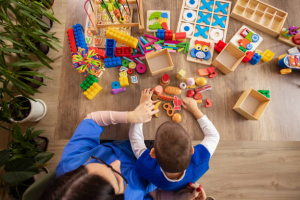 High angle view of human hands sorting and recognizing plastic items becomes a meaningful therapeutic exercise